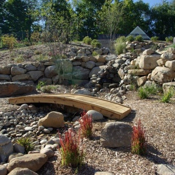 Boulder wall and pond