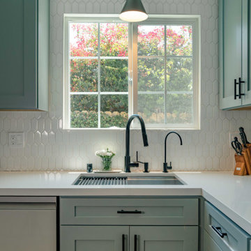 Sage Green Kitchen with White Tile Backsplash. Los Angeles