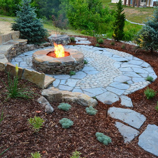Photo of a mid-sized country backyard patio in Richmond with a fire feature, concrete pavers and no cover.