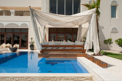 Pool - mediterranean backyard l-shaped pool idea