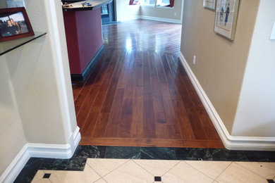 Inspiration for a contemporary medium tone wood floor living room remodel in San Diego
