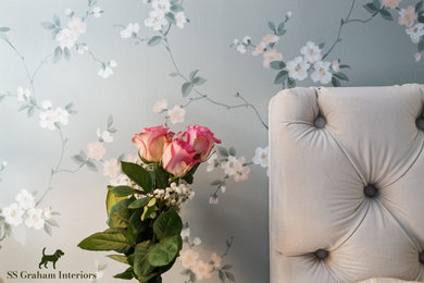 Example of a mid-sized classic master light wood floor and wallpaper bedroom design in Philadelphia with green walls