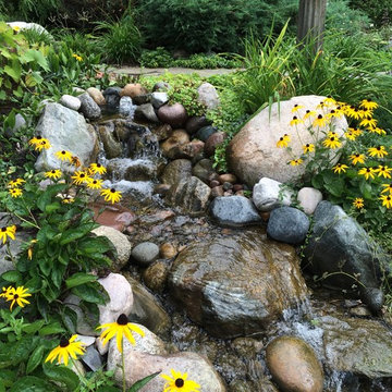 Small 6'x10' pond with 6' stream and bubbler fountain.