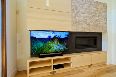 Example of a transitional living room design in Vancouver with a concealed tv