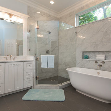 Bathroom | Elegant Custom Cabinets | Marble Tile & Freestanding Tub