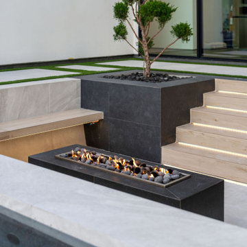 Sunken Fire Lounge with Modern Lighting and Custom Hardscape by Radelli Designs