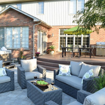 This custom Hickory Dickory Decks shows curves are in with low maintenance Veka.
