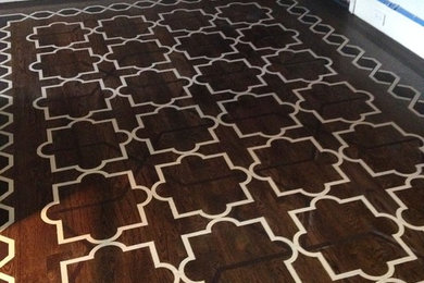 Mid-sized trendy medium tone wood floor foyer photo in New York