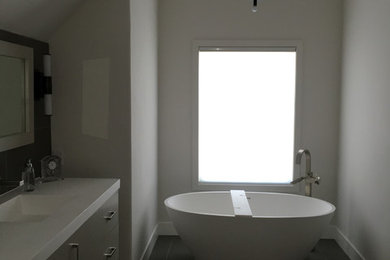 Inspiration for a mid-sized modern master ceramic tile ceramic tile bathroom remodel in San Francisco with flat-panel cabinets, white walls and an integrated sink