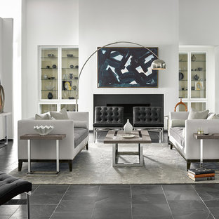 Inspiration för ett funkis allrum med öppen planlösning, med ett finrum, vita väggar, skiffergolv, en standard öppen spis, en spiselkrans i sten och svart golv