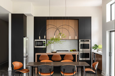 Inspiration for a contemporary concrete floor and gray floor eat-in kitchen remodel in Little Rock with a single-bowl sink, flat-panel cabinets, quartzite countertops, stone slab backsplash, stainless steel appliances and an island