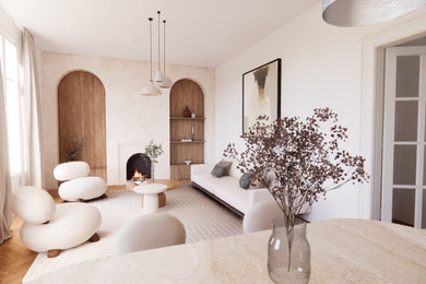 Idées déco pour un salon beige et blanc contemporain de taille moyenne et fermé avec un mur beige, parquet clair, une cheminée standard, un manteau de cheminée en béton, aucun téléviseur et un sol marron.