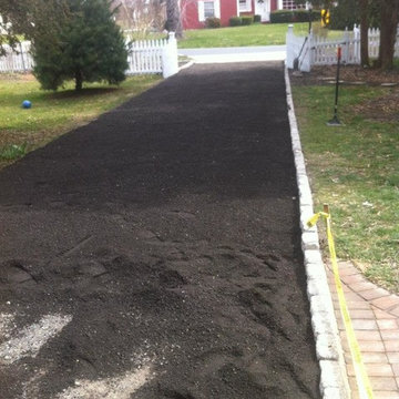 Cobblestone edging & asphalt millings atop existing driveway