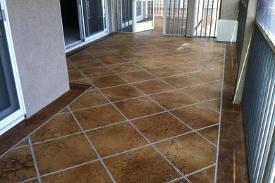 Patio - mid-sized contemporary stamped concrete patio idea in Other