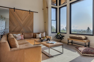 Example of a beach style living room design in Other