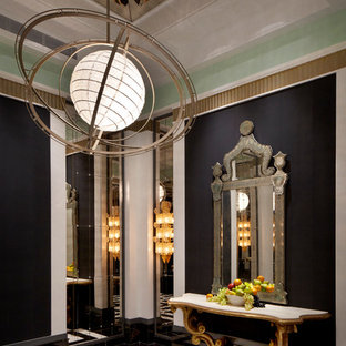 This is an example of an expansive eclectic foyer in Hong Kong with black walls and marble floors.