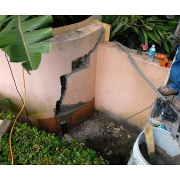 Before damaged cement block wall