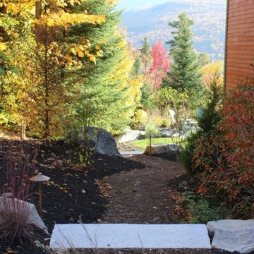 Winding wood chip path connects the front yard to the back