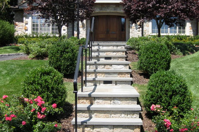 Photo of a small traditional partial sun front yard stone garden path in New York.