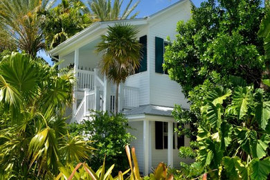 Photo of a large tropical full sun landscaping in Miami.