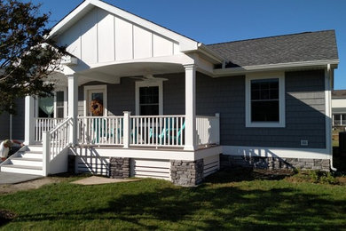 Small elegant gray one-story wood exterior home photo in Other with a shingle roof