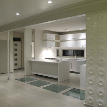 Modern urban open floor plan with structural glass floor panels and circular wal