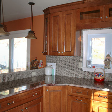 Traditional toffee kitchen remodel with multi-color mosaic tile back-splash