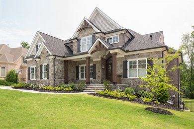 Example of a country home design design in Atlanta