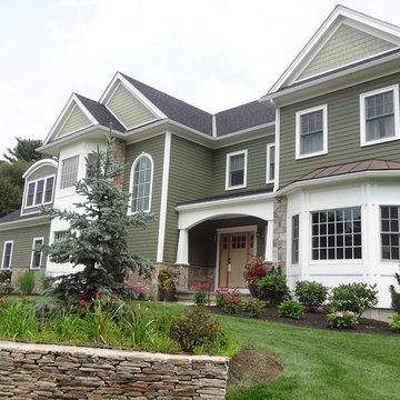 Combining Colonial Tan Natural Stone with Olive Green Siding
