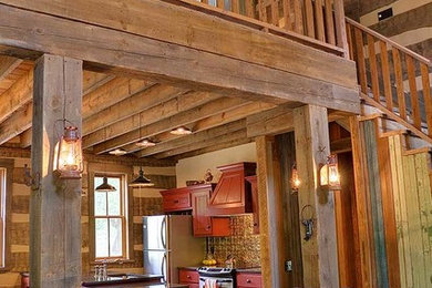 Example of a mid-sized country concrete floor and brown floor entryway design in Austin with brown walls and a medium wood front door