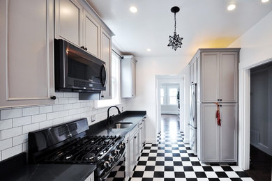 Inspiration for a large timeless single-wall ceramic tile eat-in kitchen remodel in San Francisco with an integrated sink and stainless steel appliances