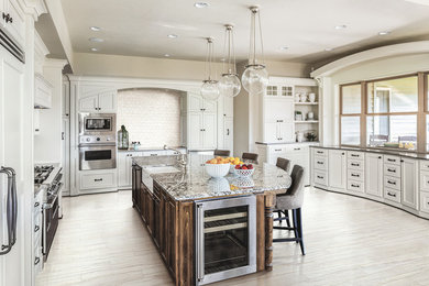 Example of a porcelain tile and white floor kitchen design in DC Metro with white backsplash