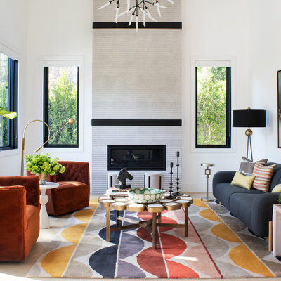 Example of a large trendy open concept light wood floor, beige floor and exposed beam living room design in Los Angeles with white walls