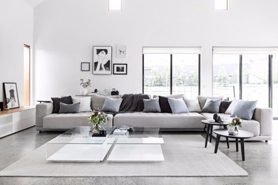 Design ideas for a large contemporary open concept living room in Melbourne with white walls, concrete floors and grey floor.