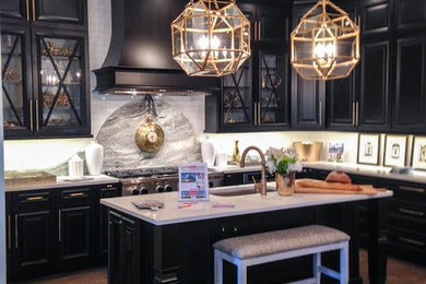 Eat-in kitchen - mid-sized contemporary l-shaped dark wood floor and brown floor eat-in kitchen idea in Atlanta with an undermount sink, raised-panel cabinets, black cabinets, marble countertops, white backsplash, subway tile backsplash, stainless steel appliances and an island