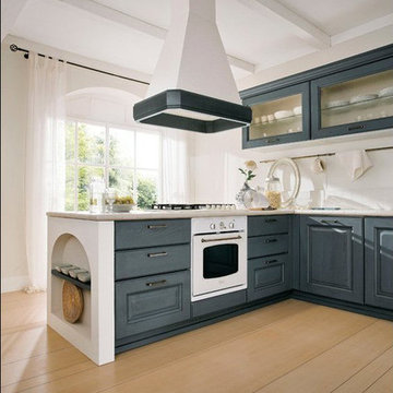 Contemporary kitchen with grey cabinetry and arched shelves