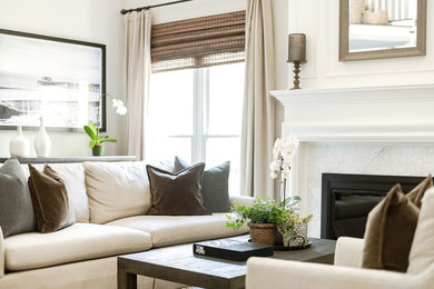 Inspiration for a beach style formal enclosed living room in Charlotte with beige walls and a standard fireplace.