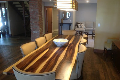 Large trendy medium tone wood floor great room photo in New York with beige walls and no fireplace
