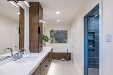 Inspiration for a large 1960s master blue tile and ceramic tile terrazzo floor, white floor and double-sink alcove shower remodel in Dallas with flat-panel cabinets, dark wood cabinets, a one-piece toilet, white walls, an undermount sink, quartz countertops, a hinged shower door, white countertops, a niche and a floating vanity