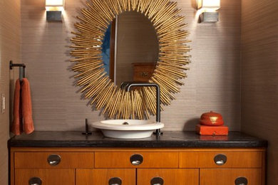 Small trendy light wood floor powder room photo in Other with a vessel sink, furniture-like cabinets, medium tone wood cabinets and beige walls