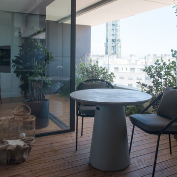 Terrace with Round Table, Black Chairs and City View