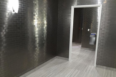 Example of a large transitional porcelain tile bathroom design in Miami with gray walls