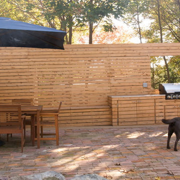 wood slat wall with outdoor kitchen