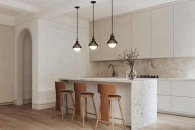 Eat-in kitchen - small single-wall light wood floor, brown floor and exposed beam eat-in kitchen idea in New York with an undermount sink, gray cabinets, marble countertops, gray backsplash, marble backsplash, paneled appliances, an island and gray countertops