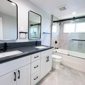 Modern White Shaker Eco-Friendly Bathroom Remodel with Black Quartz Countertop