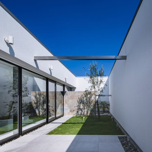 大阪の中サイズのモダンスタイルのおしゃれな中庭のテラス (日よけなし) の写真