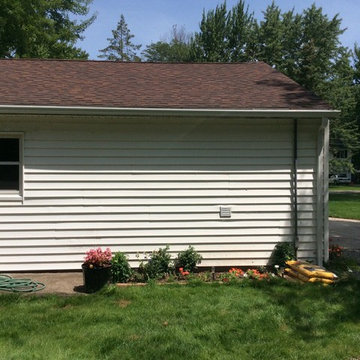 Replaced valleys and rotted plywood, installed new 5 inch gutters and guards