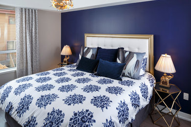 Bedroom - contemporary guest medium tone wood floor bedroom idea in Ottawa with blue walls and no fireplace