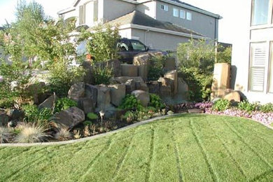 Design ideas for a large traditional partial sun backyard stone formal garden in Columbus.