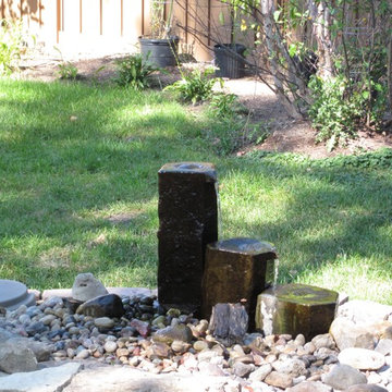 Basalt column fountain provides aeration and recirculates the water